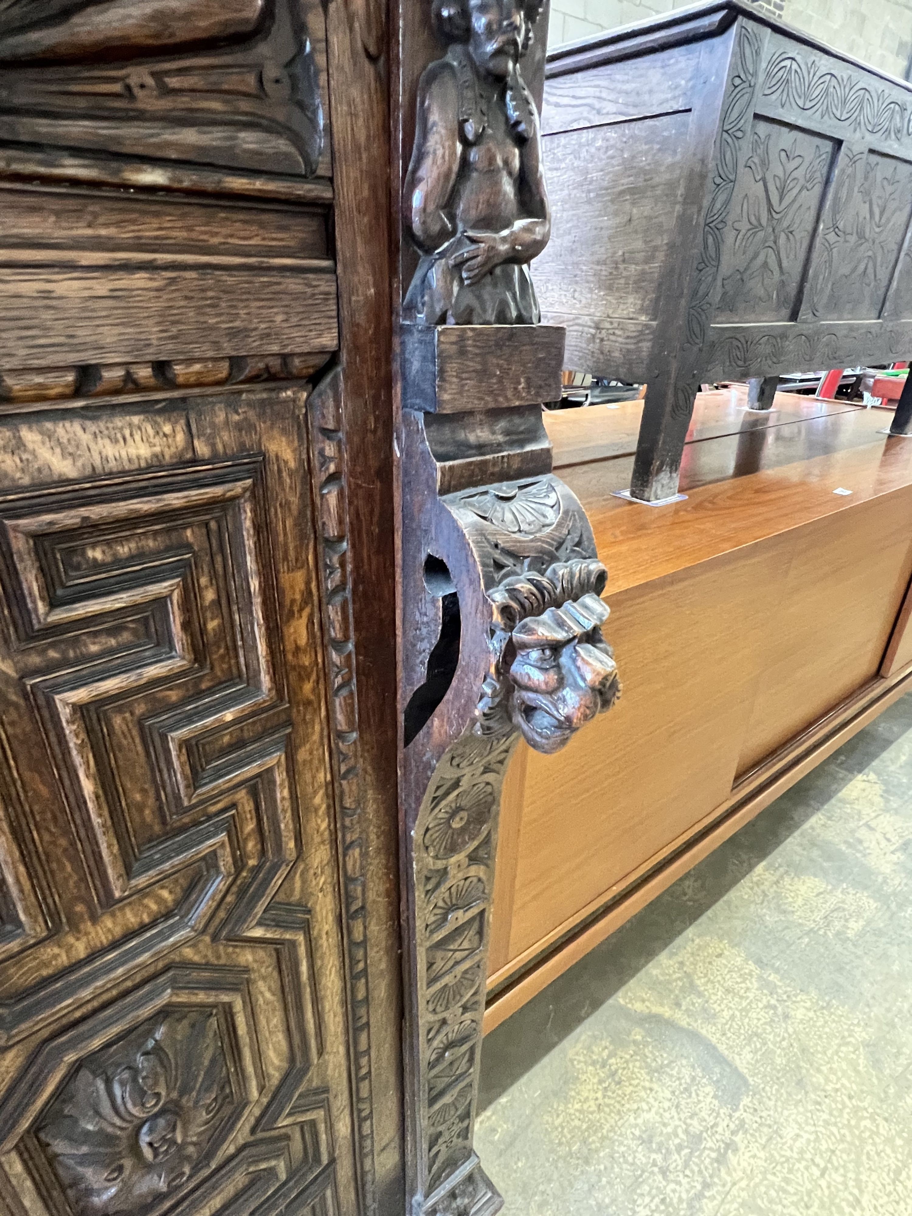 A Jacobean revival carved oak press cupboard, width 115cm depth 63cm height 156cm